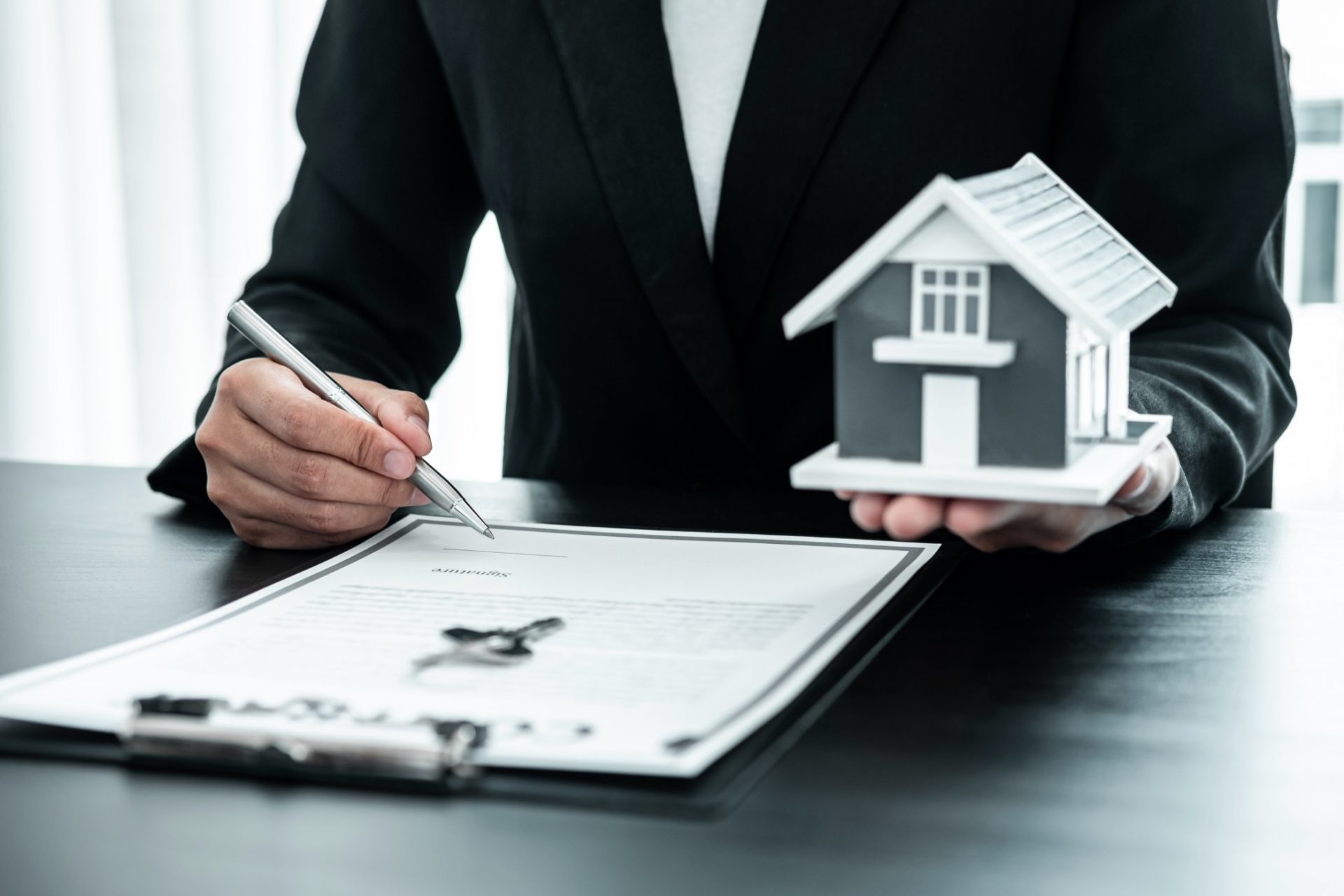 real-estate-agent-working-sign-agreement-document-contract-for-home-loan-insurance_t20_YE7axO